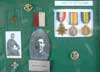Pictures and medals which belonged to Cpl. Walter Tobin.